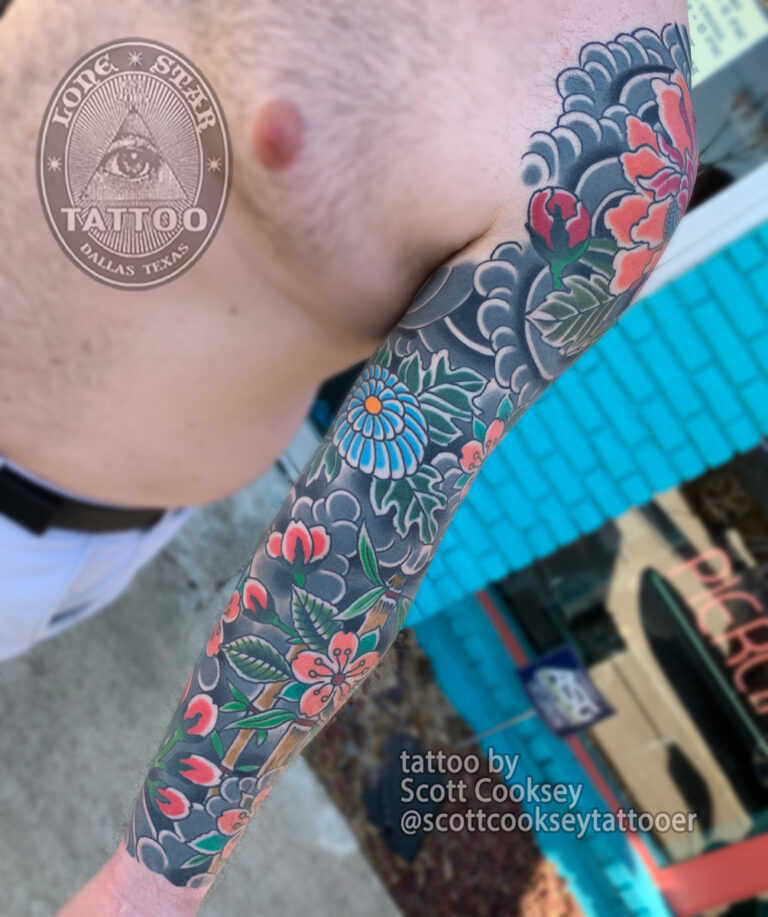 Traditional japanese flower sleeve tattoo by Scott Cooksey