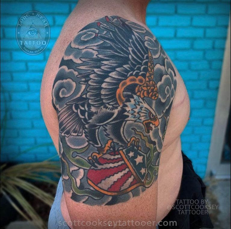 Traditional eagle crest clouds tattoo by Scott Cooksey