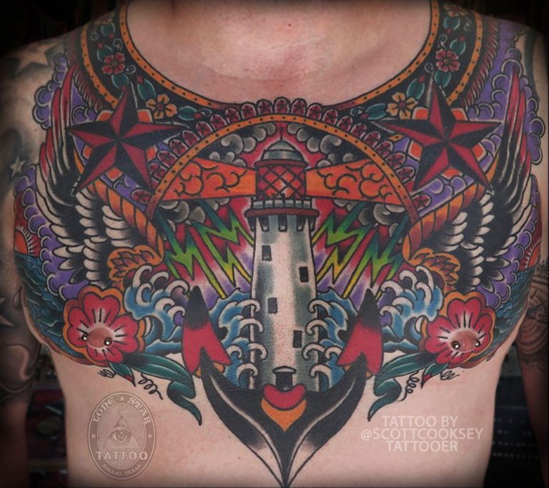 Traditional lighthouse chest piece anchor flowers tattoo by Scott Cooksey