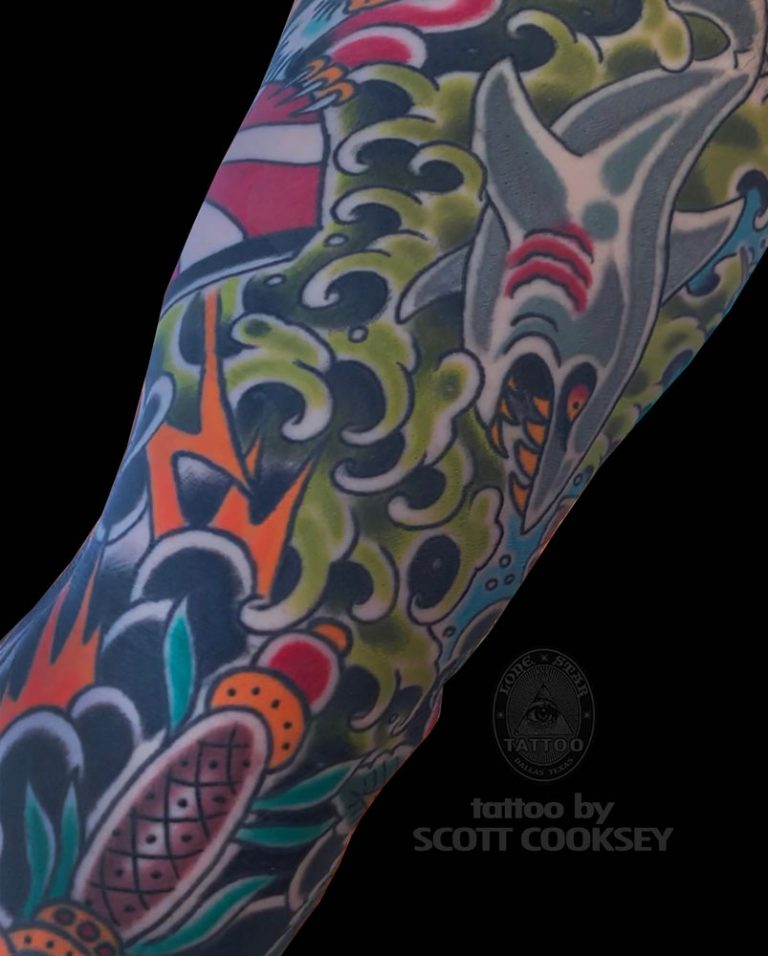Traditional shark dagger waves tattoo by Scott Cooksey