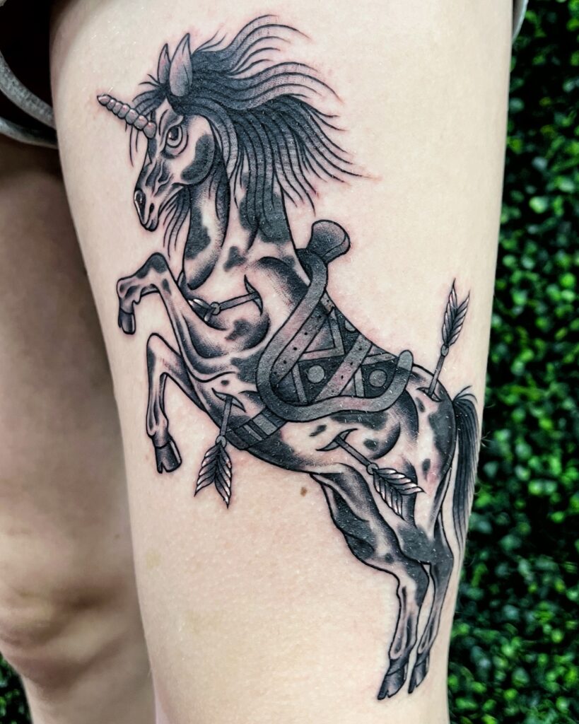 Blackwork unicorn tattoo